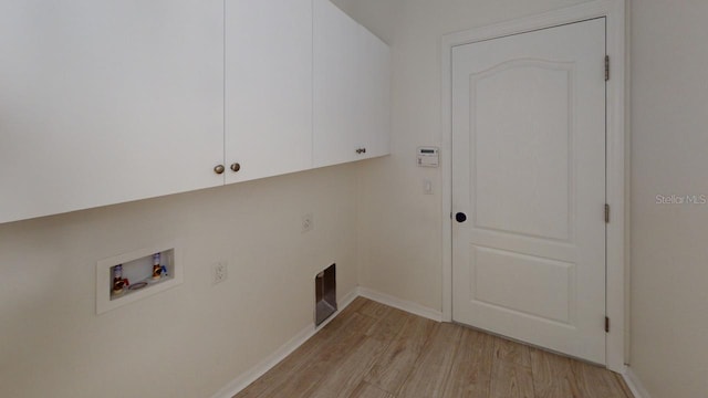 11822 Crawford Parrish Ln, Parrish, FL 34219 - clothes washing area with cabinet space, hookup for a washing machine, light wood-type flooring, and baseboards