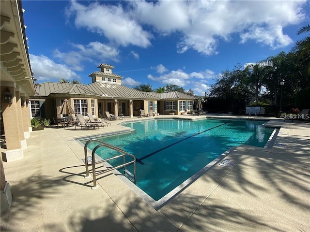 11822 Crawford Parrish Ln, Parrish, FL 34219 - community pool featuring a patio area