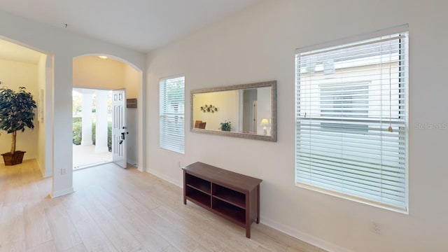 11822 Crawford Parrish Ln, Parrish, FL 34219 - hall featuring arched walkways and wood finished floors