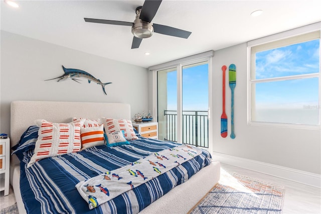bedroom featuring multiple windows, recessed lighting, ceiling fan, and baseboards