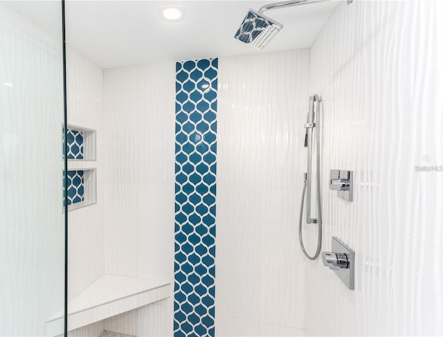 bathroom with tiled shower
