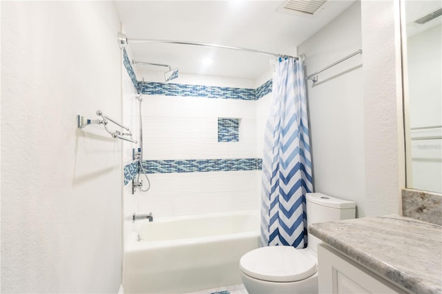 bathroom featuring toilet, shower / tub combo with curtain, and vanity