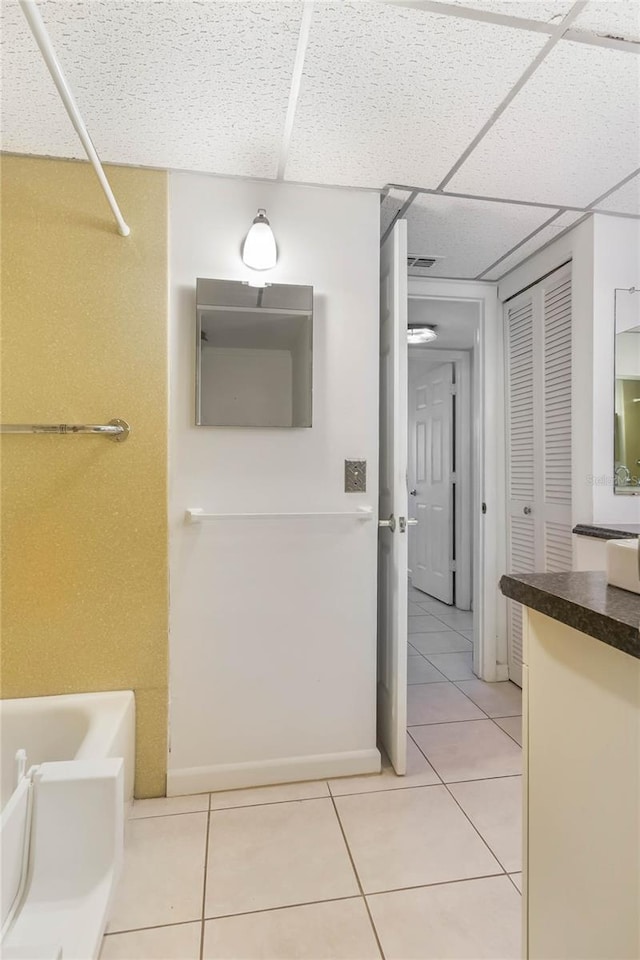 19029 US Highway 19 N Unit 2-12, Clearwater, FL 33764 - bathroom featuring vanity, tile patterned flooring, a drop ceiling, shower / tub combination, and a closet