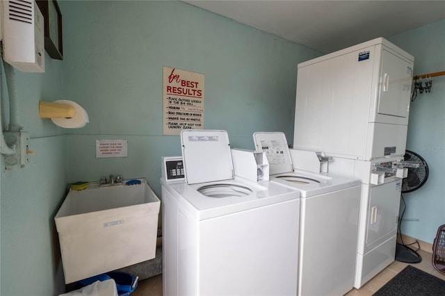 19029 US Highway 19 N Unit 2-12, Clearwater, FL 33764 - shared laundry featuring stacked washer and clothes dryer and light tile patterned floors
