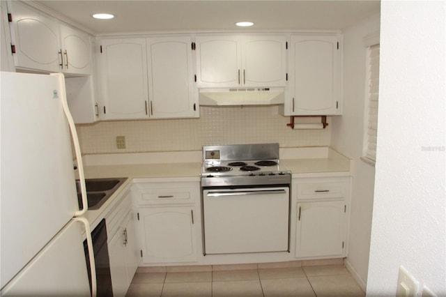 19029 US Highway 19 N Unit 2-12, Clearwater, FL 33764 - kitchen featuring white appliances, under cabinet range hood, light tile patterned flooring, backsplash, and a sink