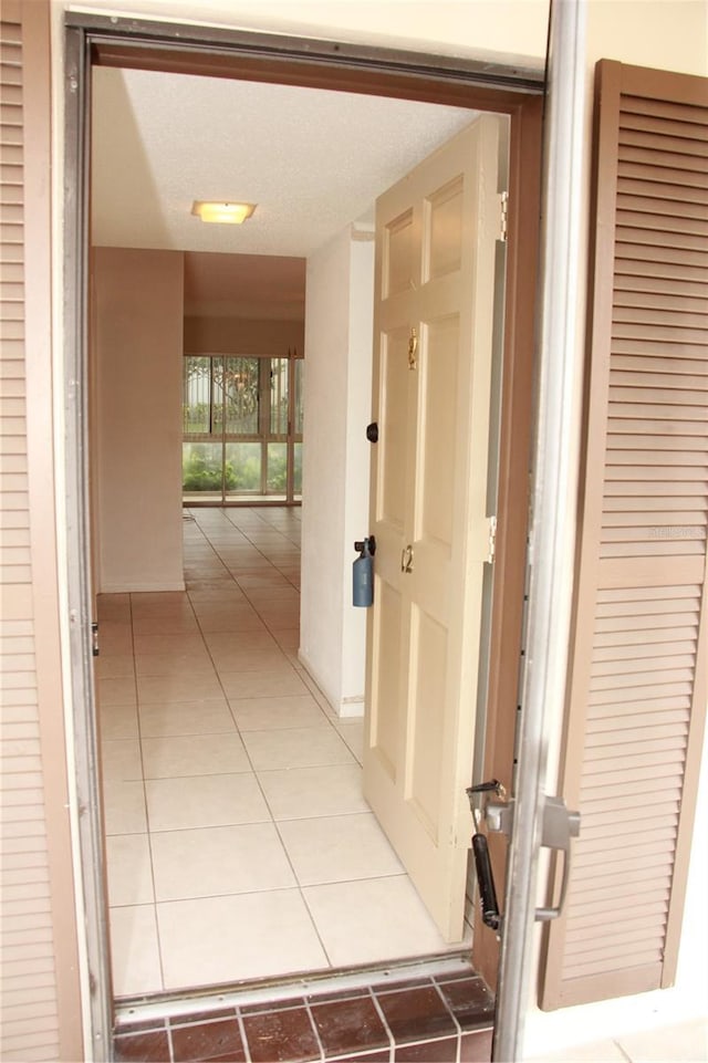 19029 US Highway 19 N Unit 2-12, Clearwater, FL 33764 - hall with light tile patterned floors
