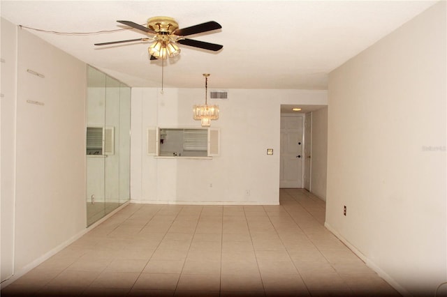 19029 US Highway 19 N Unit 2-12, Clearwater, FL 33764 - tiled spare room featuring a ceiling fan and baseboards