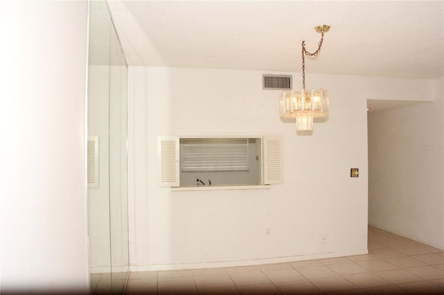 19029 US Highway 19 N Unit 2-12, Clearwater, FL 33764 - unfurnished room with a chandelier
