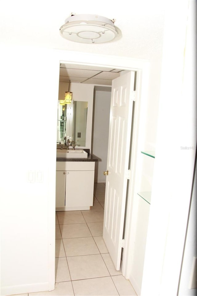 19029 US Highway 19 N Unit 2-12, Clearwater, FL 33764 - hallway featuring light tile patterned floors and a sink