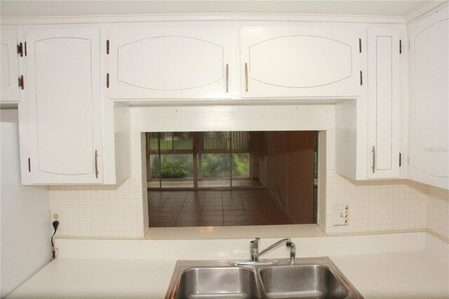 19029 US Highway 19 N Unit 2-12, Clearwater, FL 33764 - kitchen featuring a sink, decorative backsplash, light countertops, and white cabinets