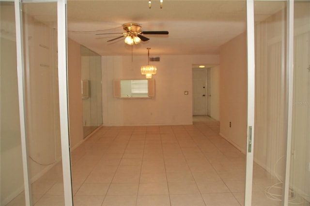 19029 US Highway 19 N Unit 2-12, Clearwater, FL 33764 - empty room with a ceiling fan and light tile patterned flooring