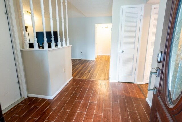 hall with baseboards and wood tiled floor