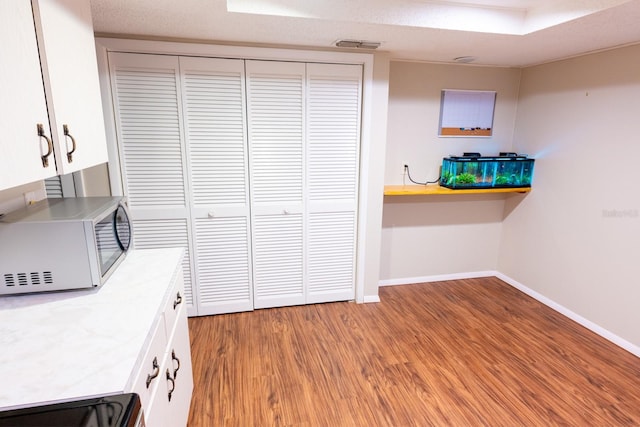 interior space with visible vents, baseboards, and light wood finished floors
