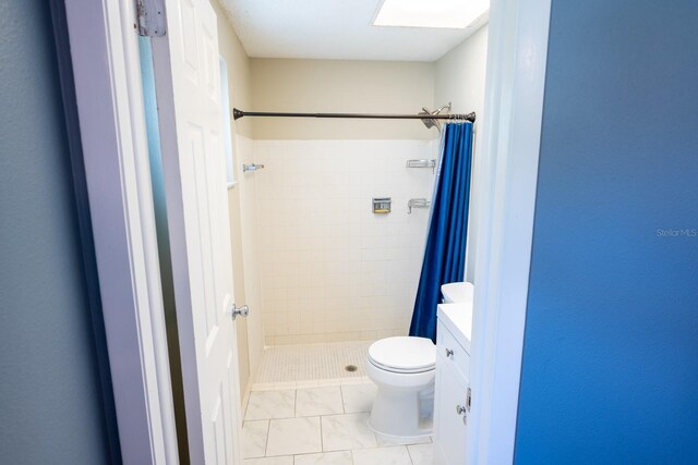 full bathroom featuring vanity, toilet, and a stall shower