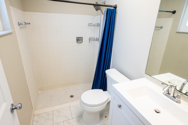 full bathroom with vanity, toilet, marble finish floor, and a shower stall