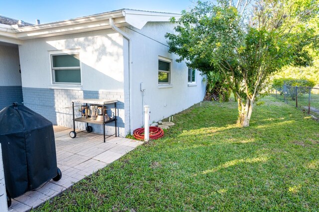 view of yard featuring a patio area and fence