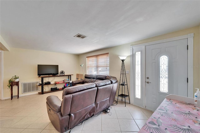 2533 Limewood Dr, Holiday, FL 34690 - living room featuring light tile patterned flooring and baseboards