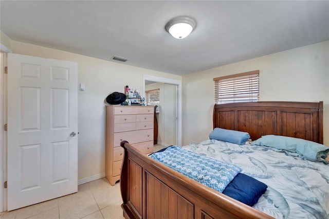 2533 Limewood Dr, Holiday, FL 34690 - bedroom with light tile patterned flooring and a closet