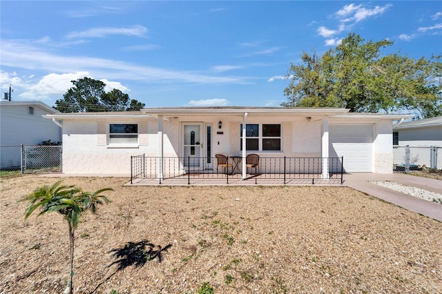 2533 Limewood Dr, Holiday, FL 34690 - single story home featuring a garage, stucco siding, a porch, and concrete driveway