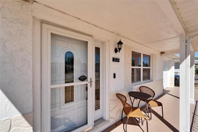 2533 Limewood Dr, Holiday, FL 34690 - doorway to property featuring a porch
