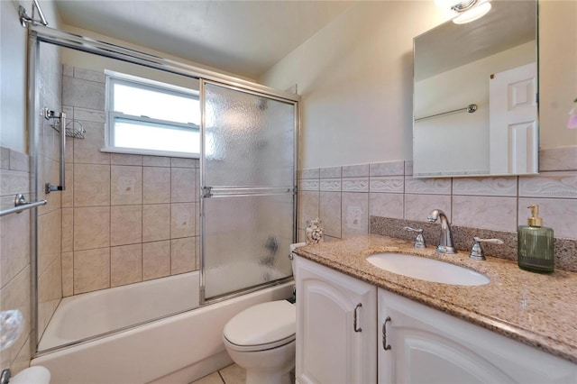 2533 Limewood Dr, Holiday, FL 34690 - full bath with vanity, combined bath / shower with glass door, and tile walls