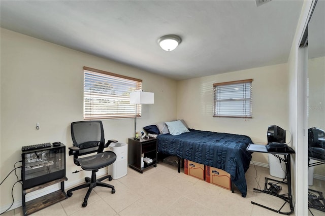 2533 Limewood Dr, Holiday, FL 34690 - bedroom with multiple windows, a desk, and tile patterned flooring