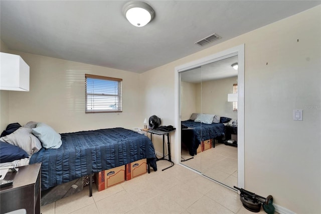 2533 Limewood Dr, Holiday, FL 34690 - bedroom with a closet and light tile patterned floors