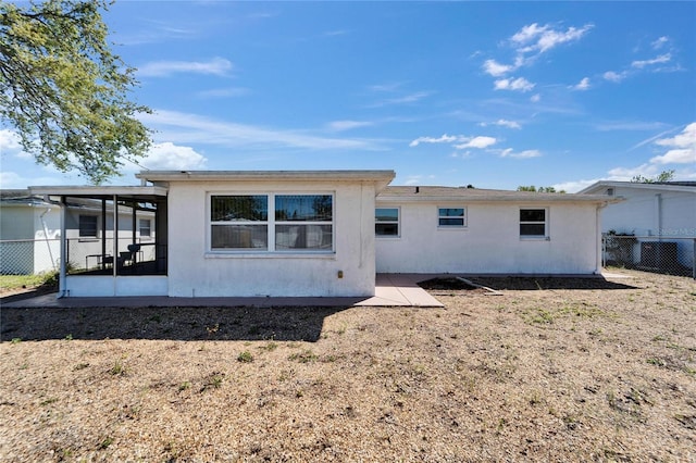 2533 Limewood Dr, Holiday, FL 34690 - back of house with a sunroom and stucco siding