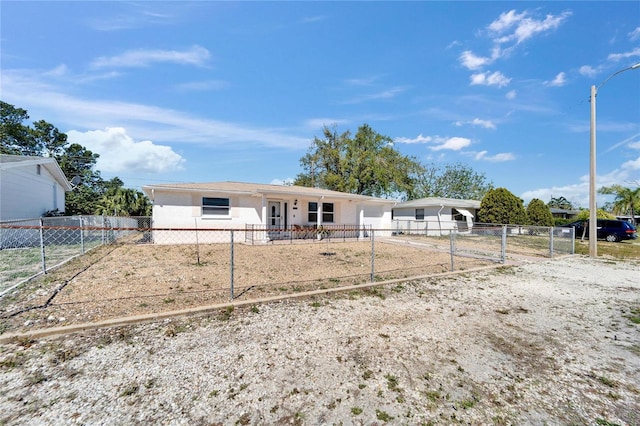 2533 Limewood Dr, Holiday, FL 34690 - view of front of property with a fenced front yard and stucco siding