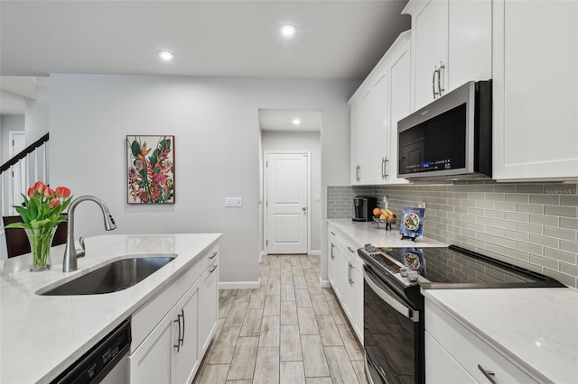 19398 Great Intention Way, Lutz, FL 33558 - kitchen featuring light countertops, a sink, appliances with stainless steel finishes, and tasteful backsplash