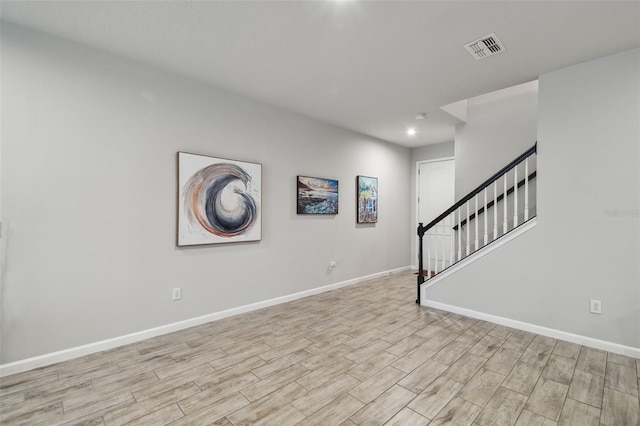 19398 Great Intention Way, Lutz, FL 33558 - interior space with stairway, baseboards, light wood-style floors, and visible vents