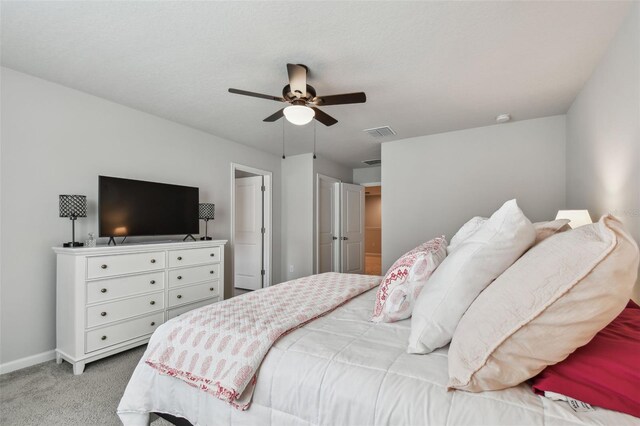 19398 Great Intention Way, Lutz, FL 33558 - carpeted bedroom featuring baseboards, visible vents, and ceiling fan