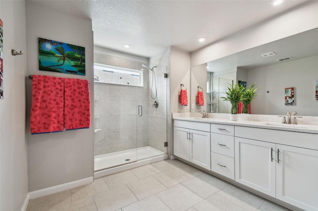 19398 Great Intention Way, Lutz, FL 33558 - full bathroom featuring tile patterned flooring, a sink, double vanity, and a stall shower