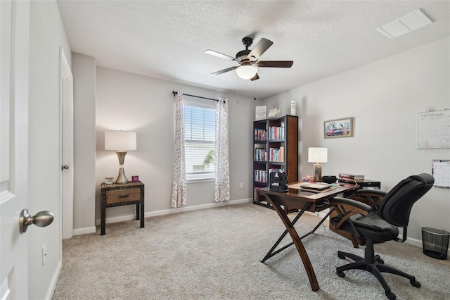 19398 Great Intention Way, Lutz, FL 33558 - office space featuring visible vents, a ceiling fan, baseboards, a textured ceiling, and light colored carpet