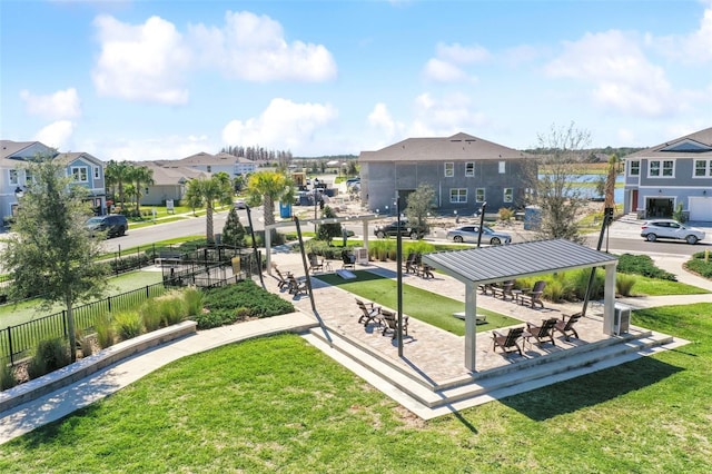 19398 Great Intention Way, Lutz, FL 33558 - surrounding community with fence, a lawn, and a residential view