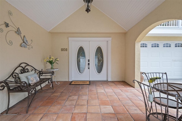 378 Tennessee Ave, Crystal Beach, FL 34681 - doorway to property featuring stucco siding, a garage, and a patio