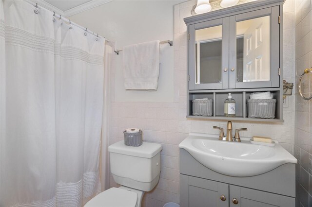 378 Tennessee Ave, Crystal Beach, FL 34681 - bathroom featuring vanity, tile walls, toilet, ornamental molding, and curtained shower