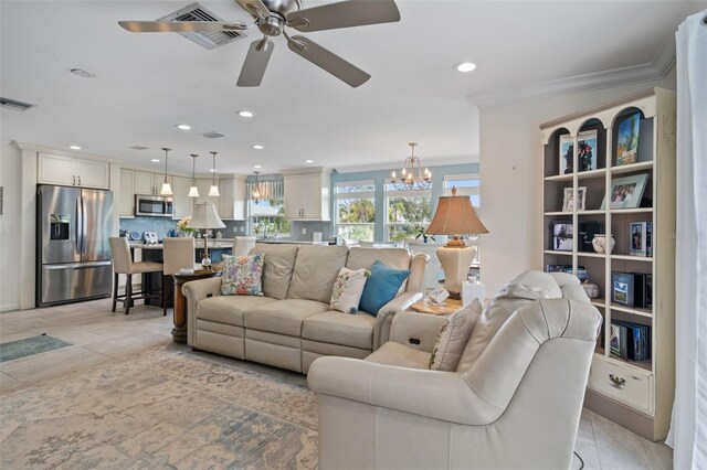 378 Tennessee Ave, Crystal Beach, FL 34681 - living room featuring recessed lighting, ornamental molding, ceiling fan with notable chandelier, light tile patterned flooring, and visible vents