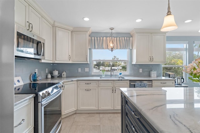 378 Tennessee Ave, Crystal Beach, FL 34681 - kitchen featuring a sink, decorative backsplash, appliances with stainless steel finishes, and a healthy amount of sunlight