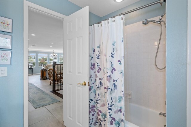 378 Tennessee Ave, Crystal Beach, FL 34681 - full bathroom with an inviting chandelier, tile patterned floors, shower / tub combo with curtain, and recessed lighting