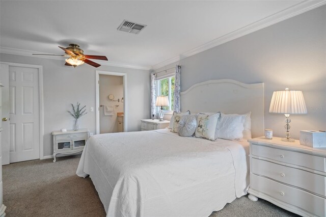 378 Tennessee Ave, Crystal Beach, FL 34681 - carpeted bedroom featuring ensuite bath, visible vents, ornamental molding, and a ceiling fan