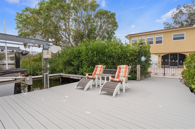 378 Tennessee Ave, Crystal Beach, FL 34681 - wooden deck featuring a dock