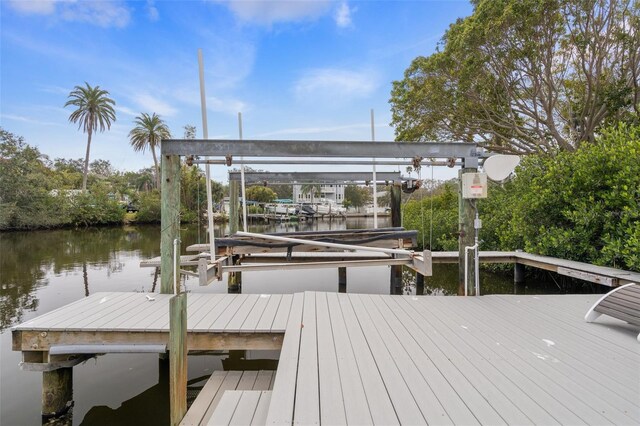 378 Tennessee Ave, Crystal Beach, FL 34681 - view of dock featuring a water view and boat lift