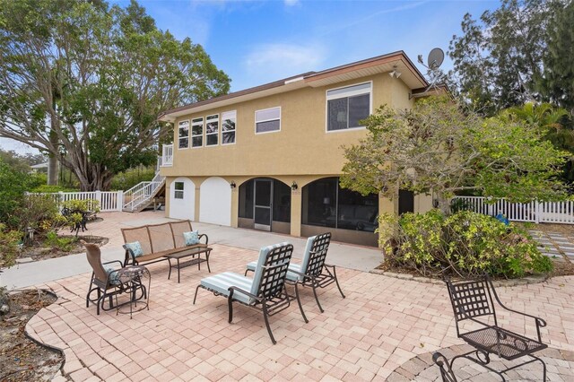 378 Tennessee Ave, Crystal Beach, FL 34681 - view of patio featuring an outdoor living space, stairs, and fence