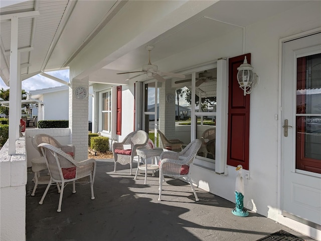 view of patio with a ceiling fan and a porch