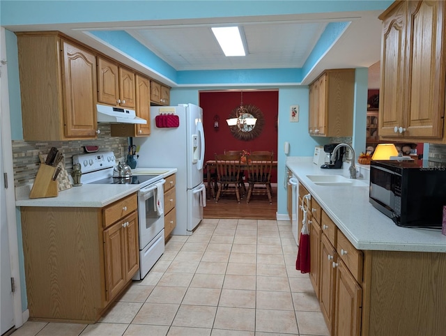 kitchen featuring under cabinet range hood, black microwave, a sink, white range with electric cooktop, and light tile patterned floors