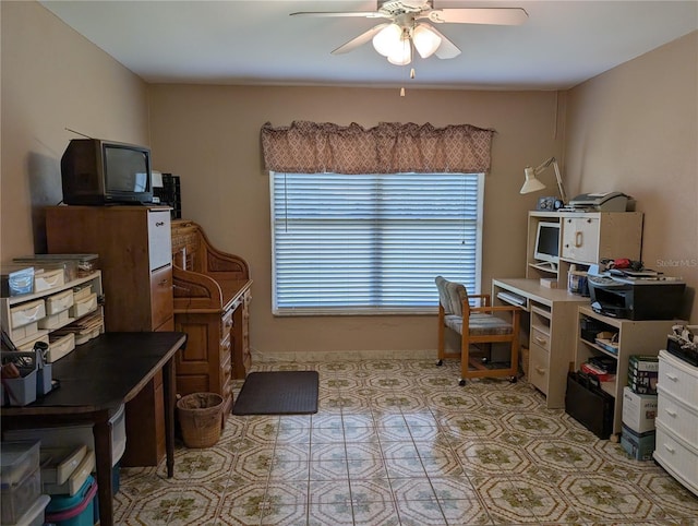 office space with light tile patterned floors and a ceiling fan