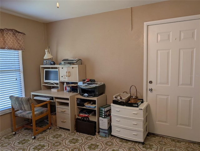 office space with light tile patterned flooring and a wealth of natural light