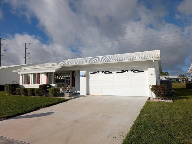 single story home with driveway, an attached garage, a front lawn, and cooling unit