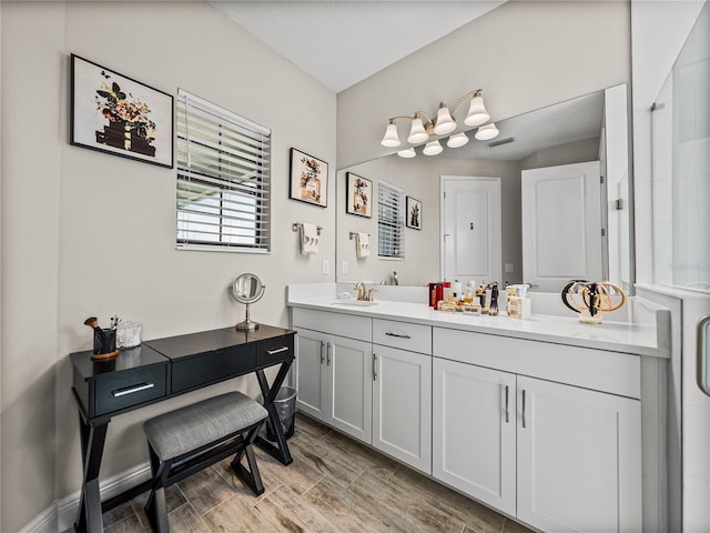 12808 Boggy Creek Dr, Riverview, FL 33579 - bathroom featuring baseboards, visible vents, wood tiled floor, and vanity